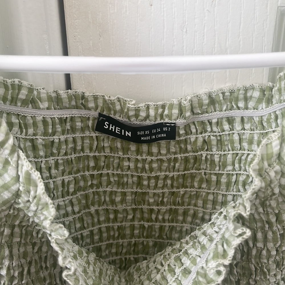 This blouse is from SHEIN in the size XS. The color contains a green & white - Picture 4 of 4